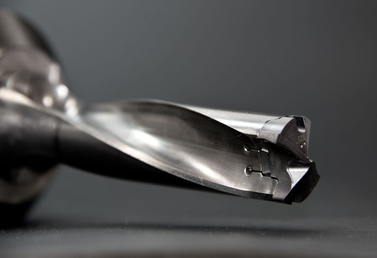 Detailed view of a sharp stainless steel drill bit, ideal for industrial use.