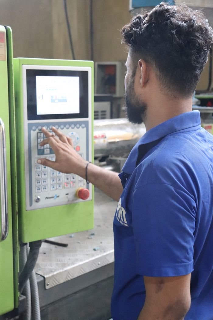 The Art of Drawing Readers In: Your attractive post title goes here A factory worker in Karachi uses a control panel of an industrial machine.